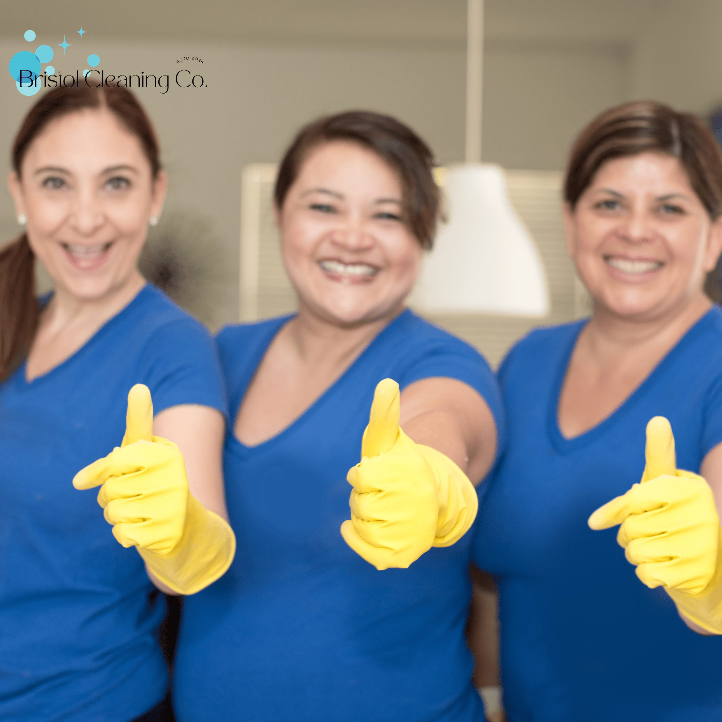 Team of smiling cleaners in Bristol Cleaning Company uniforms